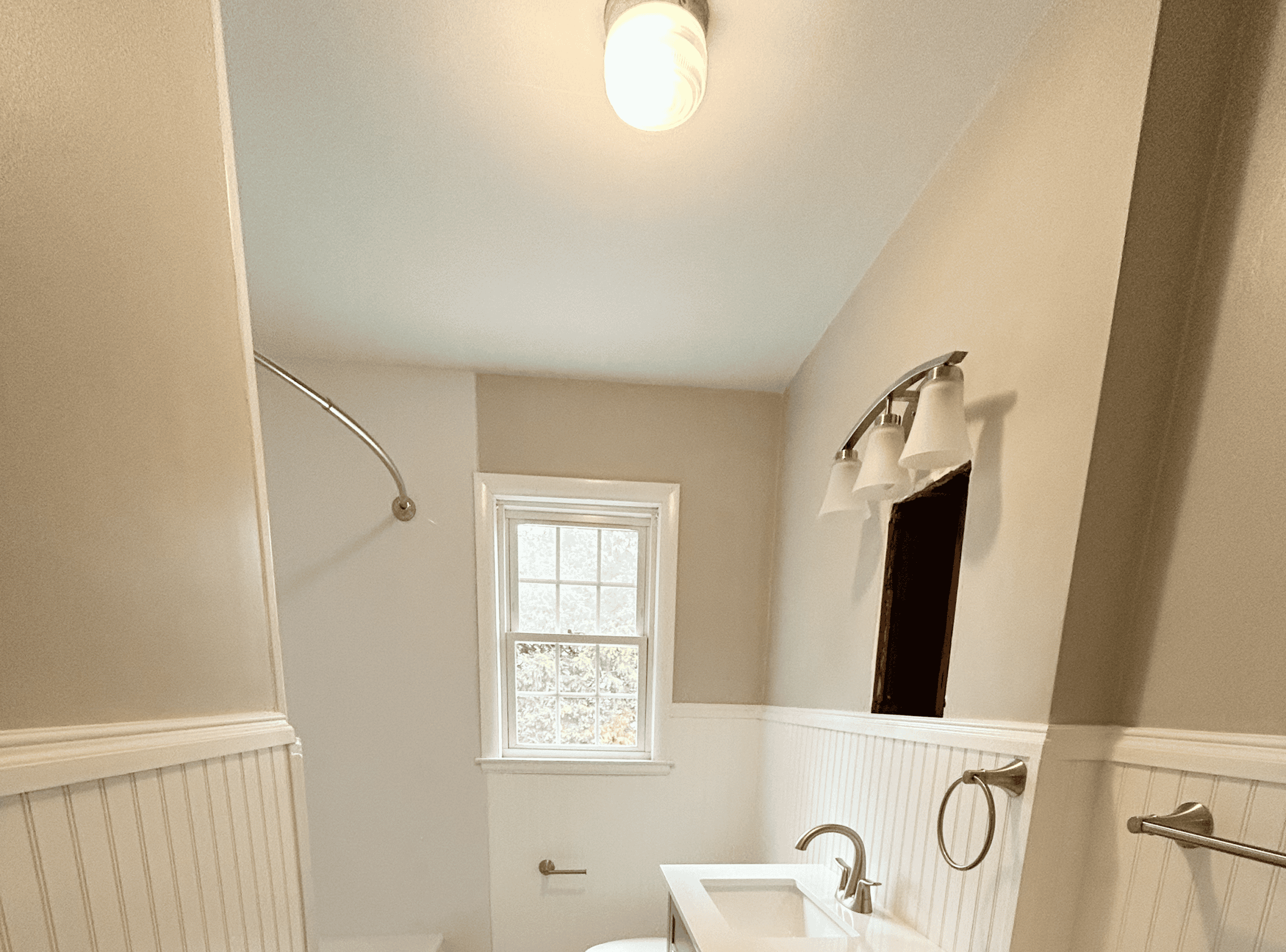 Bathroom Renovation Bathroom renovation with new fixtures and lighting. Expert home improvement services by Example Co.